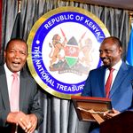New ICT cabinet secretary Eliud Owalo receives documents from his predecessor Eliud Owalo