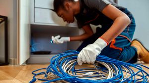 A contractor installing home fibre. 